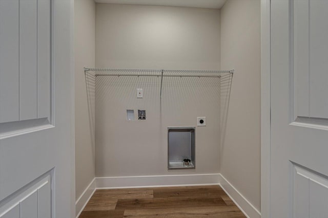 laundry area featuring electric dryer hookup, washer hookup, and wood-type flooring