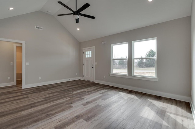 unfurnished living room with wood-type flooring, ceiling fan, and high vaulted ceiling