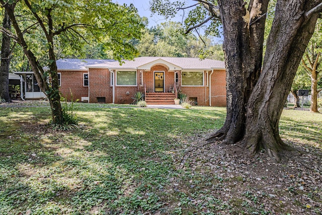 ranch-style home with a front yard