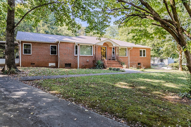 ranch-style home featuring a front yard