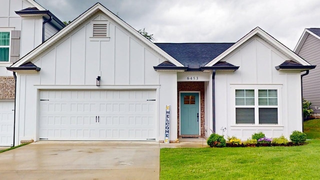 6453 Serenade Ln, Hixson, TN 37343 - view of front facade with an attached garage, board and batten siding, and driveway