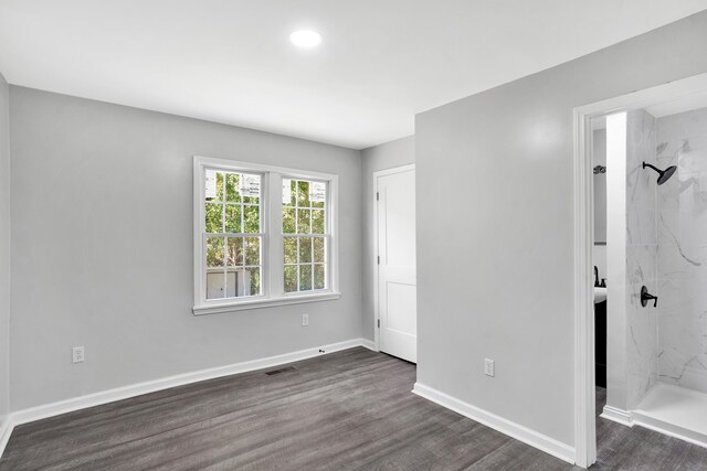 empty room with dark wood-type flooring