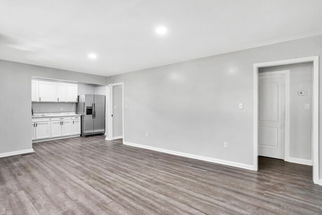 unfurnished living room with hardwood / wood-style floors