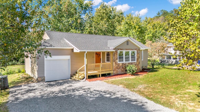 single story home featuring a garage and a front yard