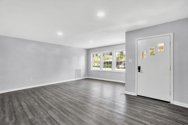 foyer with dark hardwood / wood-style floors