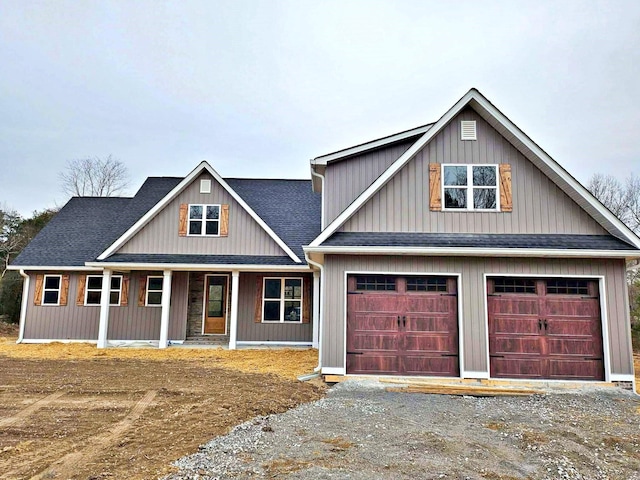 view of front of home with a porch and a garage