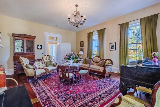 living room featuring hardwood / wood-style flooring and a notable chandelier