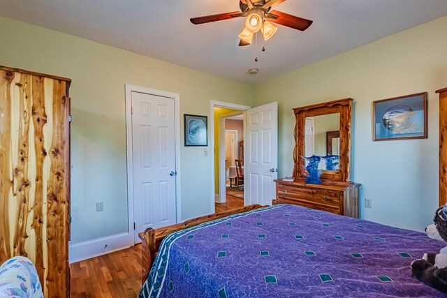 bedroom featuring hardwood / wood-style flooring and ceiling fan