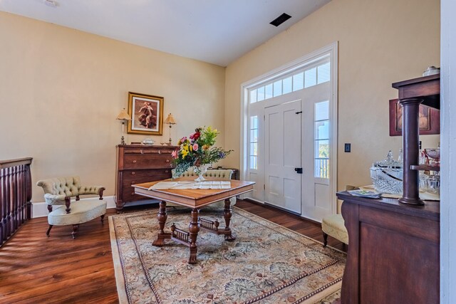 foyer with dark hardwood / wood-style flooring