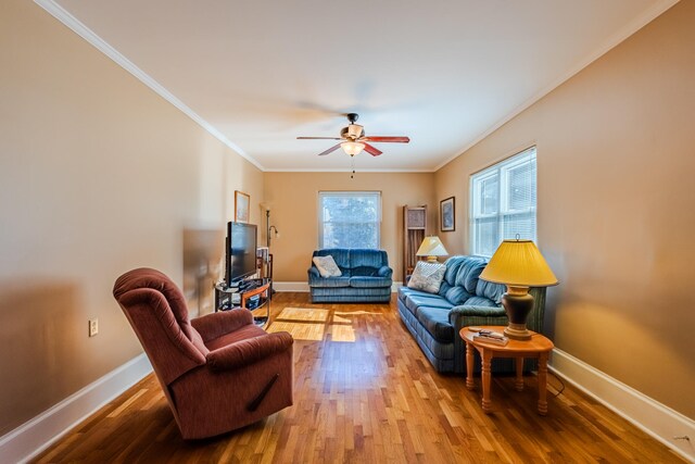 living room with ceiling fan, hardwood / wood-style floors, and ornamental molding