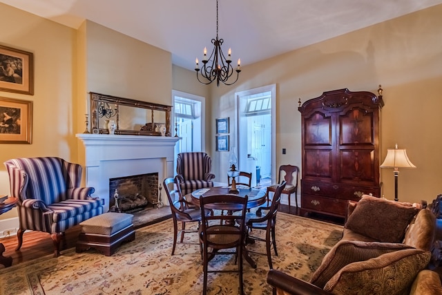 dining room with a chandelier and light wood-type flooring