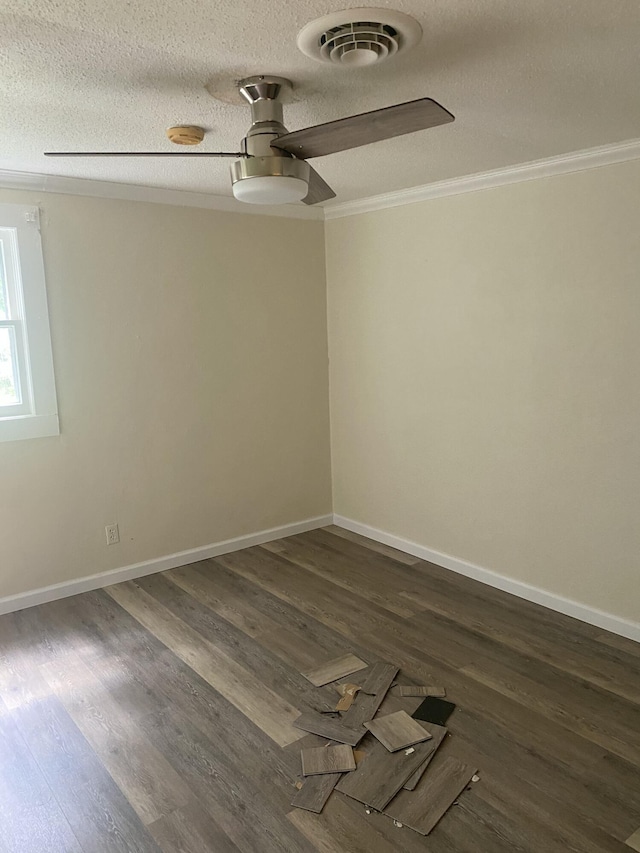 2320 Raines Dr NW, Cleveland, TN 37311 - spare room with ornamental molding, ceiling fan, dark wood-style flooring, and a textured ceiling