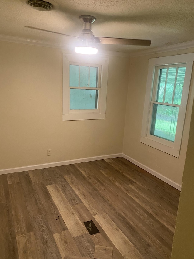 2320 Raines Dr NW, Cleveland, TN 37311 - unfurnished room with dark wood finished floors, a textured ceiling, crown molding, and a ceiling fan