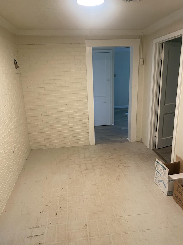 2320 Raines Dr NW, Cleveland, TN 37311 - unfurnished room featuring brick wall