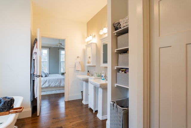 bathroom featuring ceiling fan and hardwood / wood-style floors