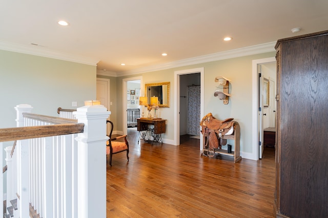 hallway featuring hardwood / wood-style flooring and ornamental molding