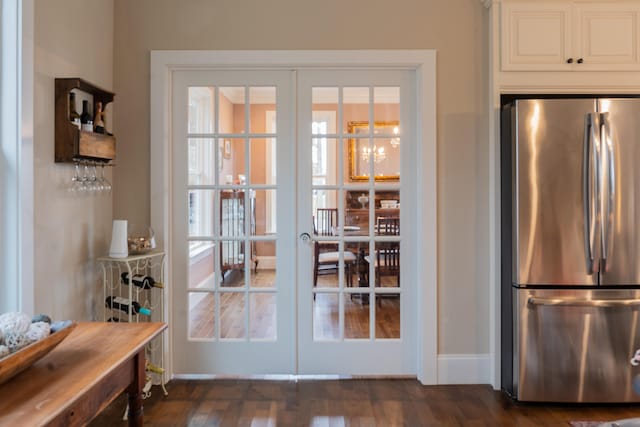 entryway with french doors and dark wood-type flooring