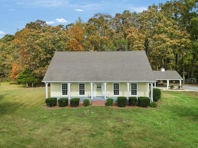 view of front of property with covered porch and a front yard