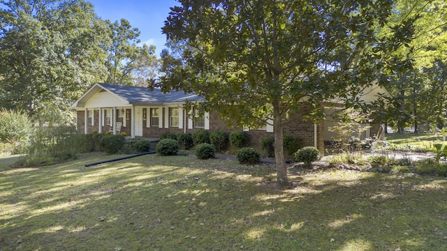 view of front facade featuring a front lawn and covered porch