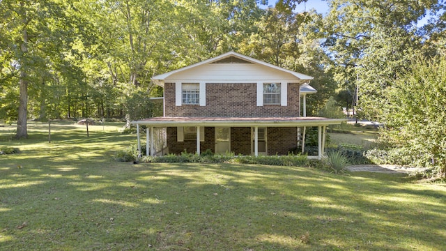 view of front property featuring covered porch and a front yard