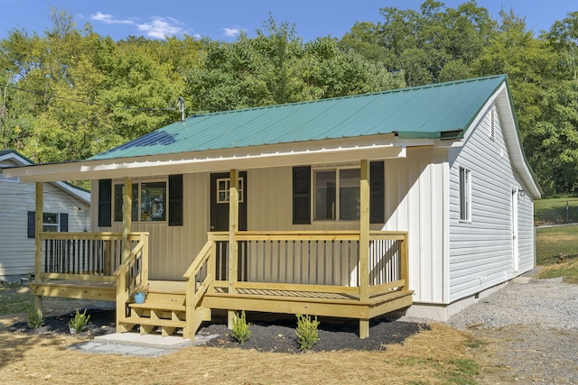 rear view of house with a porch