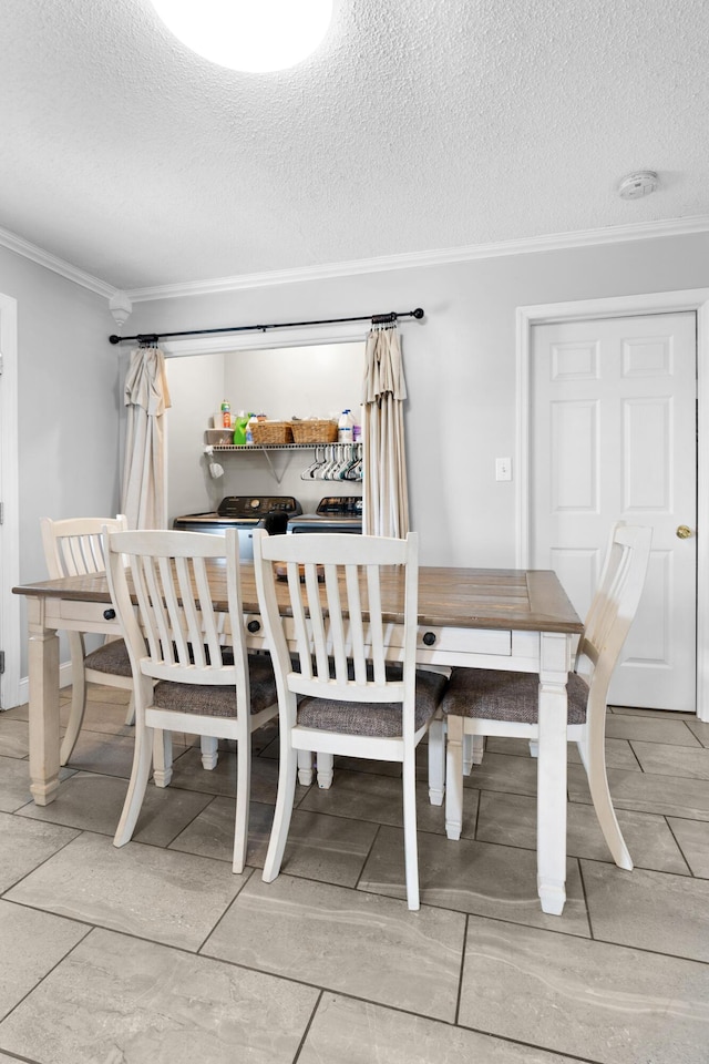 dining area with a textured ceiling and crown molding
