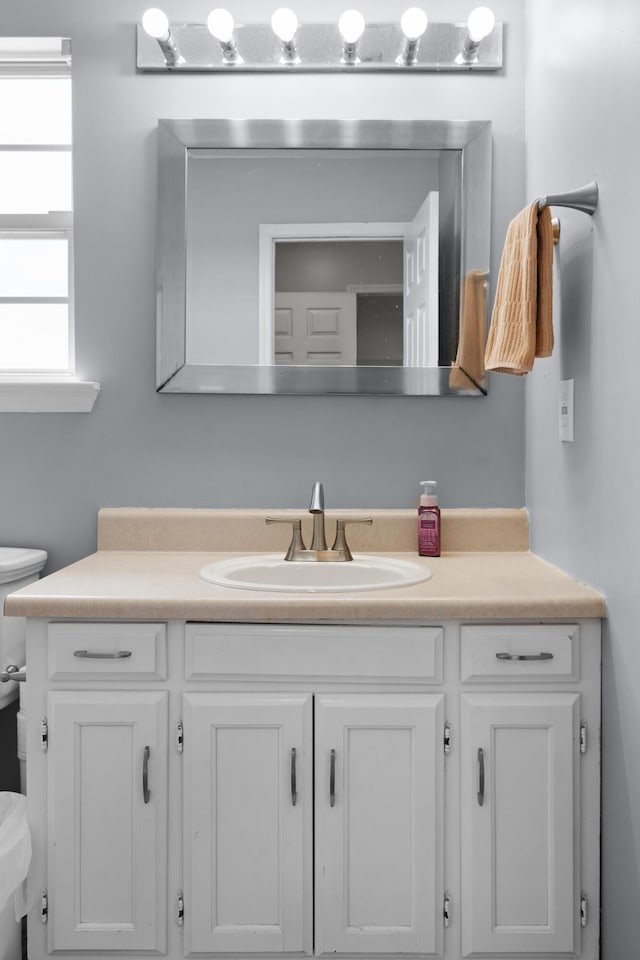 half bath with toilet and vanity