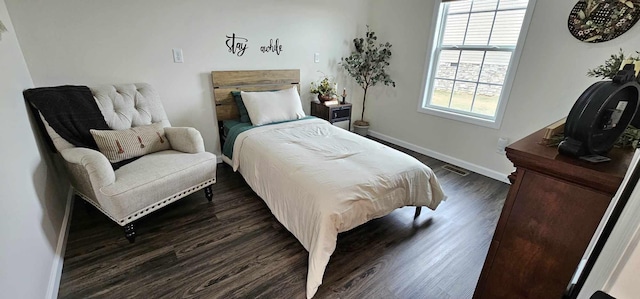 bedroom featuring dark hardwood / wood-style floors