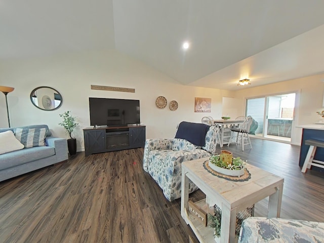 living room featuring vaulted ceiling and dark hardwood / wood-style flooring