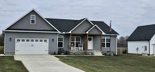 view of front of property with a garage and a front lawn