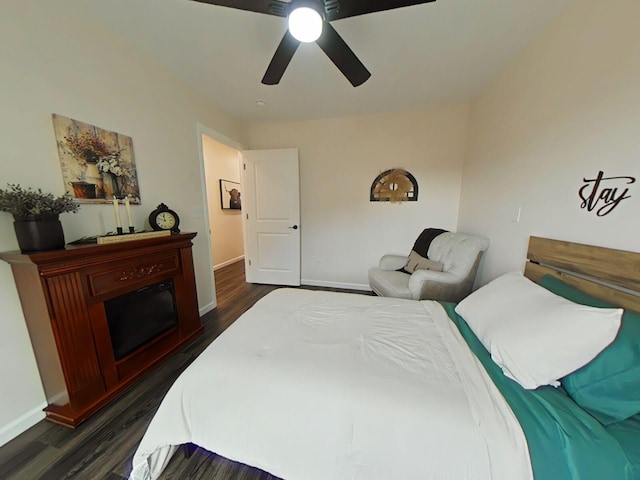 bedroom featuring ceiling fan and dark hardwood / wood-style floors