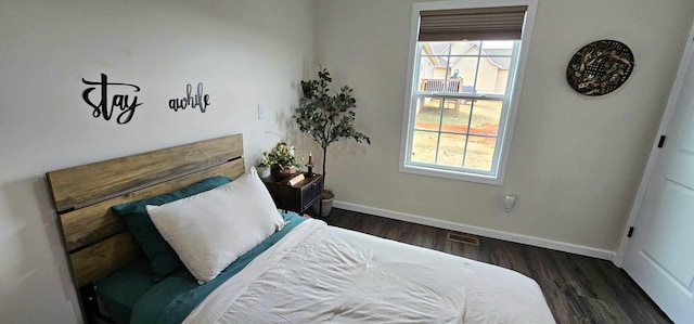 bedroom featuring dark hardwood / wood-style floors