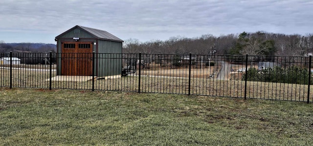 exterior space with a shed and a yard