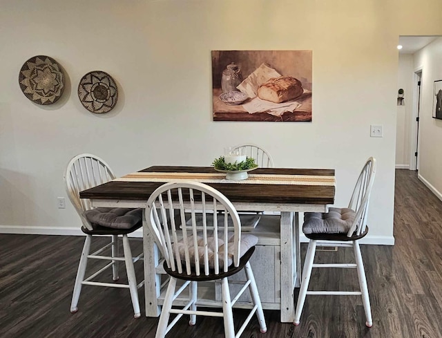 dining area with dark hardwood / wood-style floors