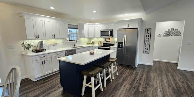 kitchen featuring sink, a center island, white cabinets, and appliances with stainless steel finishes