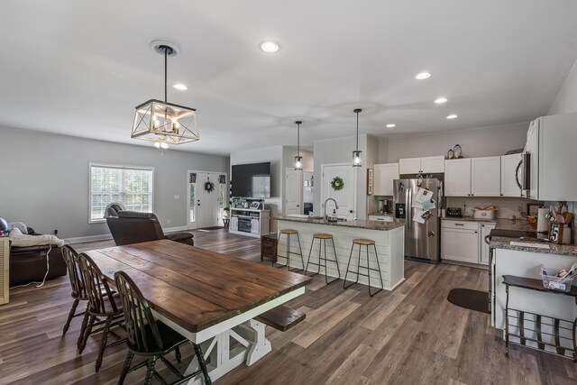 123 Tommy Loop, Sweetwater, TN 37874 - dining area with a chandelier, recessed lighting, dark wood-type flooring, and baseboards