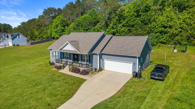123 Tommy Loop, Sweetwater, TN 37874 - view of front of property featuring a porch, a garage, concrete driveway, and a front lawn
