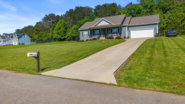 123 Tommy Loop, Sweetwater, TN 37874 - view of front of property featuring covered porch, a front lawn, and an attached garage