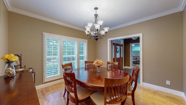 101 NW Amherst Way, Cleveland, TN 37312 - dining area featuring a chandelier, ornamental molding, and light wood finished floors