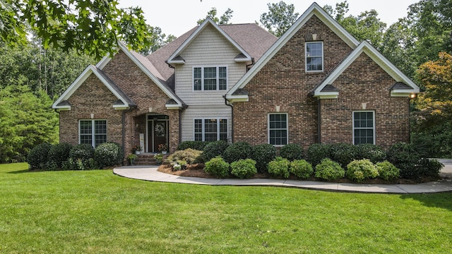 101 NW Amherst Way, Cleveland, TN 37312 - craftsman-style home with a front lawn and brick siding
