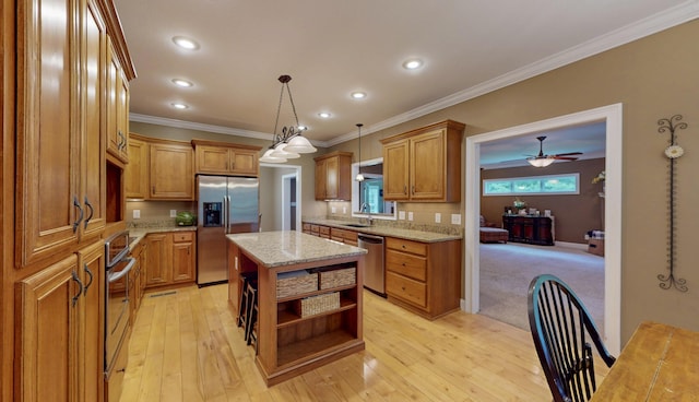 101 NW Amherst Way, Cleveland, TN 37312 - kitchen featuring appliances with stainless steel finishes, open shelves, crown molding, brown cabinets, and a kitchen island
