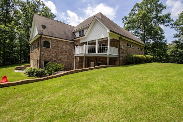 101 NW Amherst Way, Cleveland, TN 37312 - rear view of house featuring brick siding, a lawn, roof with shingles, and a wooden deck