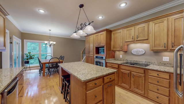 101 NW Amherst Way, Cleveland, TN 37312 - kitchen with appliances with stainless steel finishes, a center island, brown cabinetry, light wood finished floors, and crown molding