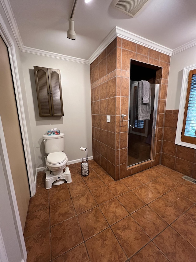105 Hicks Adams Dr, Reliance, TN 37369 - bathroom with a stall shower, tile patterned floors, crown molding, toilet, and tile walls