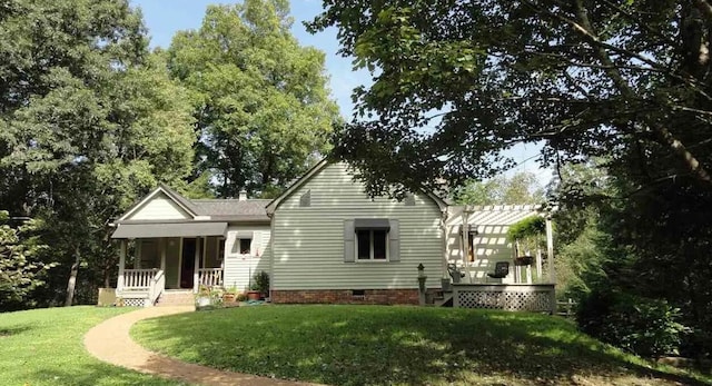 105 Hicks Adams Dr, Reliance, TN 37369 - rear view of house with covered porch and a lawn