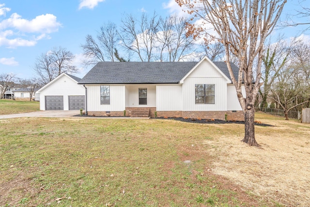 view of front of property featuring a garage and a front lawn