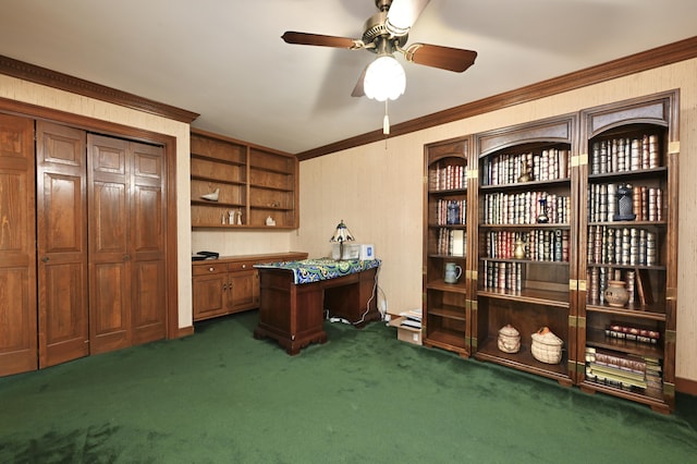 office area with ceiling fan, ornamental molding, and dark colored carpet
