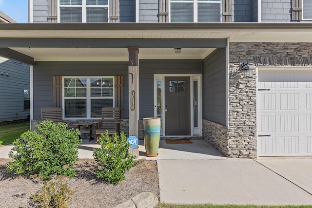 entrance to property featuring a porch