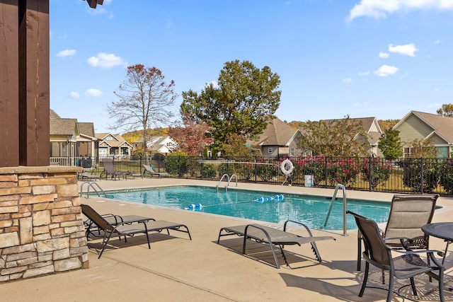 view of swimming pool with a patio area