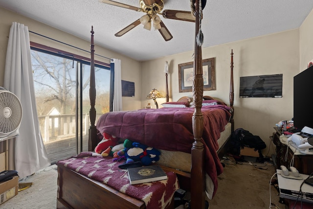 bedroom featuring access to outside, a ceiling fan, and a textured ceiling